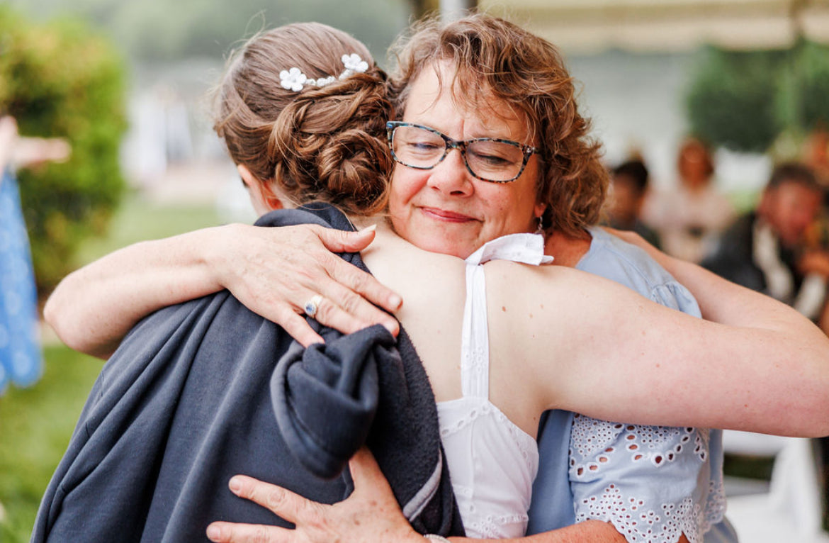 Mother and daughter hugging each other